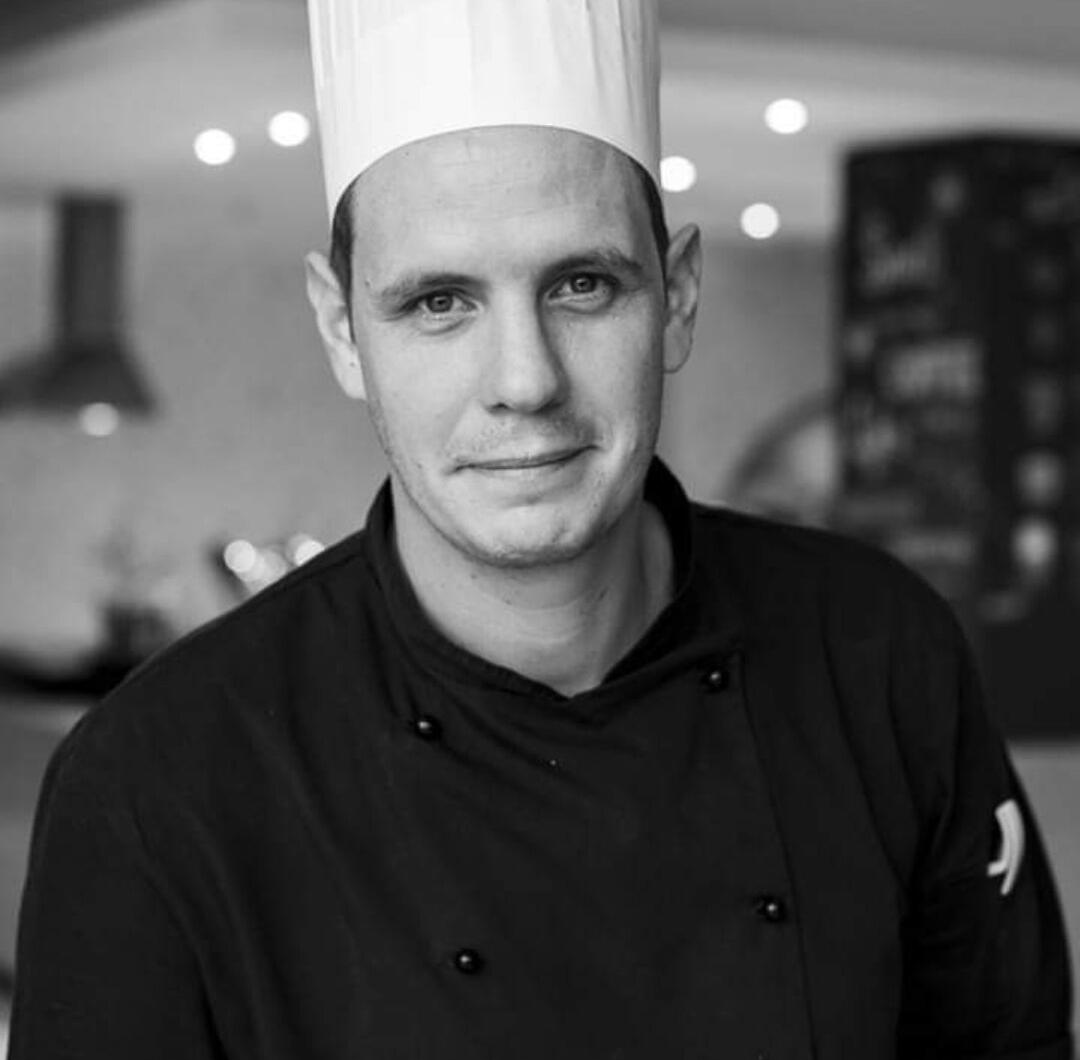 Wayne Oosthuizen Chef in Clothes with a chefs hat